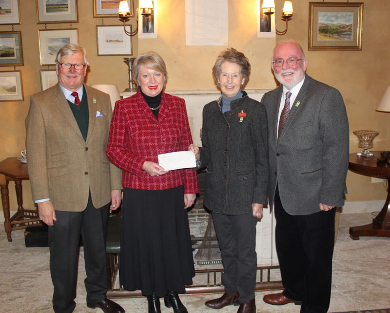 Pictured receiving the cheque at Highgrove